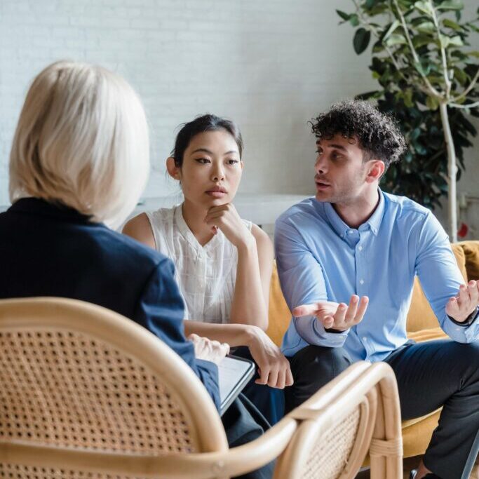 a man and woman in couples therapy learning gottman method skills