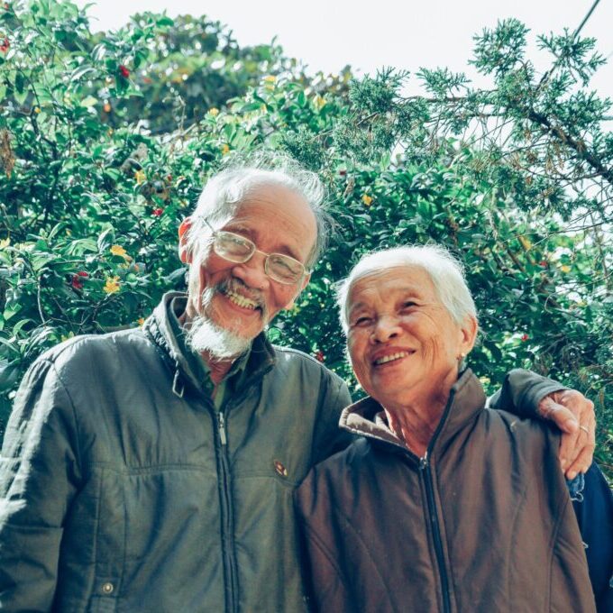 older man and woman smiling