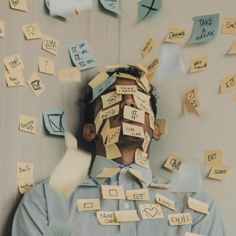 person covered with multiple sticky notes