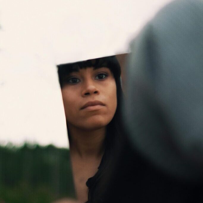 north carolina woman looking at herself in mirror